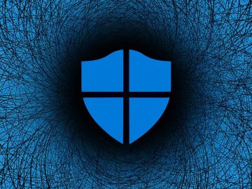 Microsoft Defender on a blue swirly background