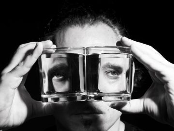 Man shown in facets of a glass square