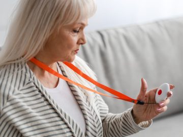 Woman holding a panic button