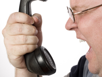 man screaming at robocalls