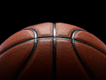 The dark side of sports betting: How mirror sites help gambling scams thrive  Half a basketball on a dark background