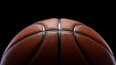 Half a basketball on a dark background