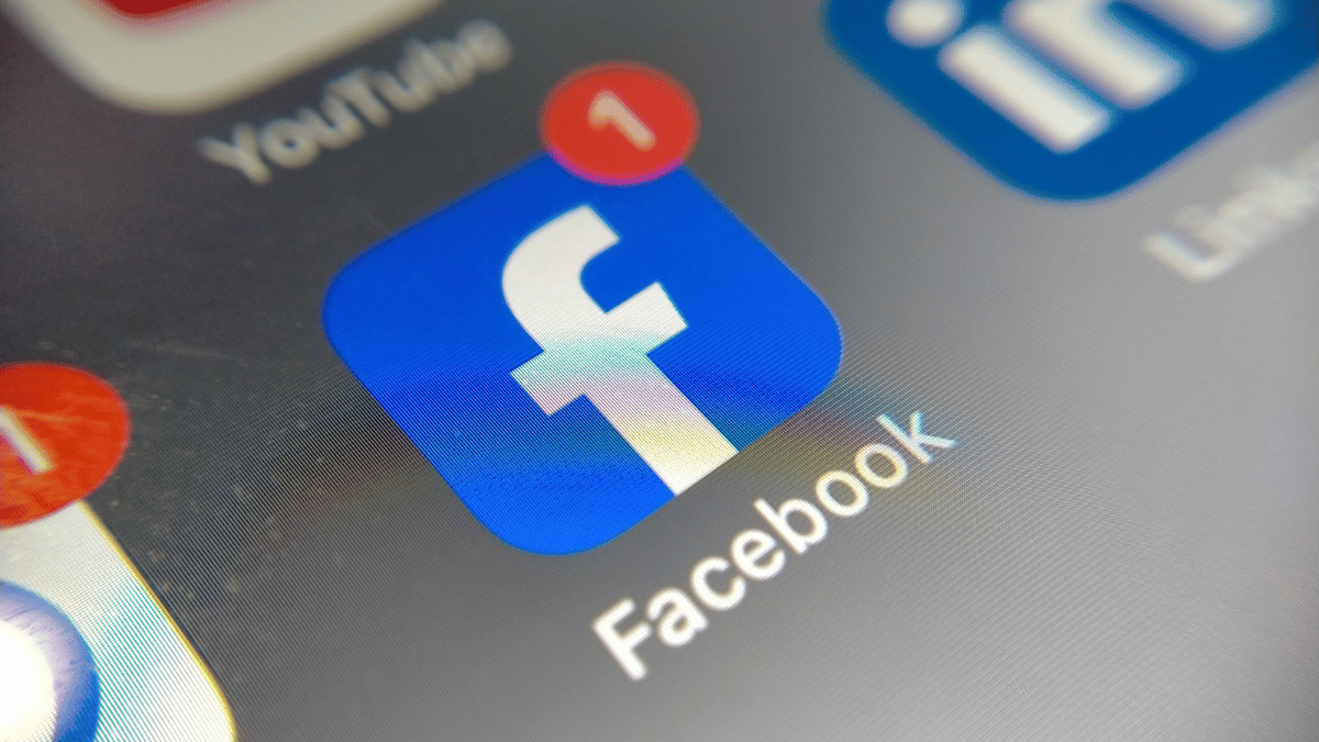 Facebook icon on a mobile phone screen