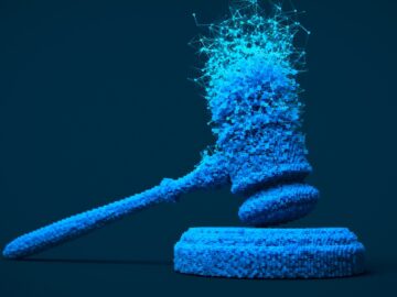 A digitally rendered gavel is splintering into different data points and nodes.