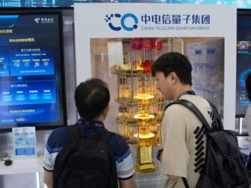 Visitors look at China Telecom's quantum computing at the Shanghai New International Expo Centre during the Mobile World Conference in June