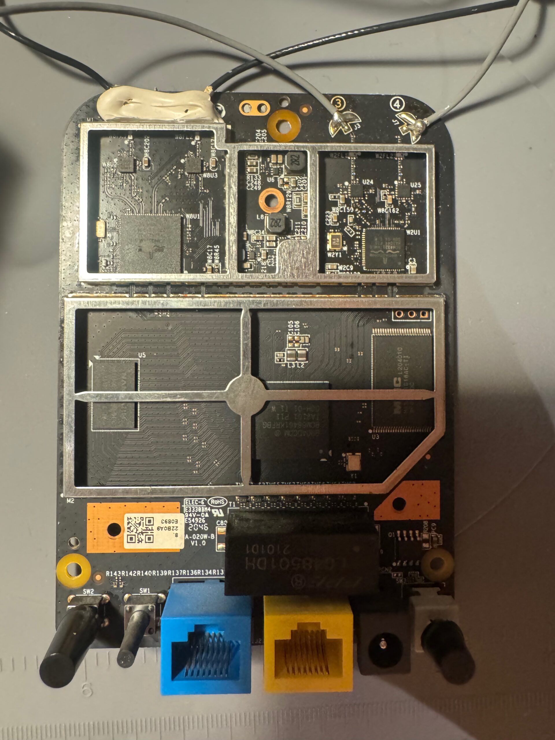 Hacking the Nokia Beacon 1 Router: UART, Command Injection, and Password Generation with Qiling Teardown Front Without RF Shield