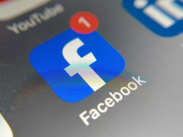 Facebook icon on a mobile phone screen