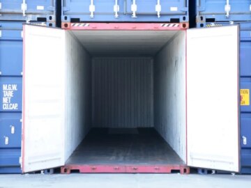 Hackers commit highway robbery, stealing cargo and goods A cargo container is opened up amidst other containers. It is entirely empty.